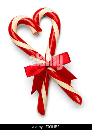 Two Candy Canes in Heart Shape with Red Bow Isolated on White Background. Stock Photo