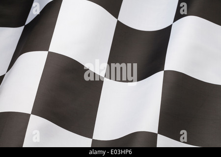 Single Checkered Flag with Wave in it Isolated on White Background. Stock Photo