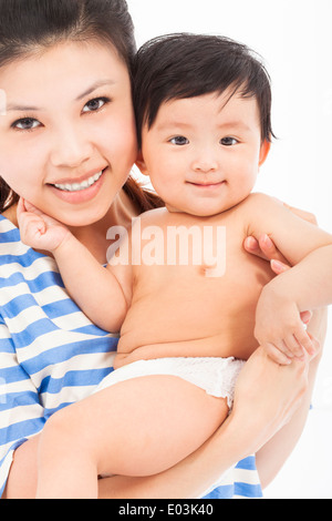Happy mother holding adorable child baby boy Stock Photo
