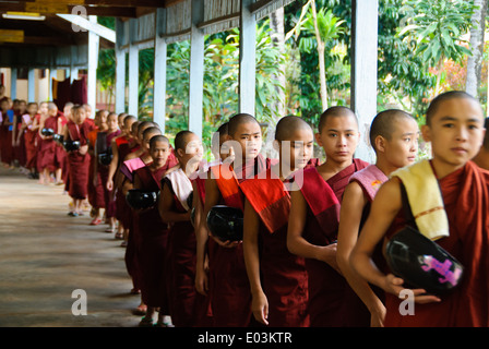 Buddhist novices lining up for lunch. Stock Photo