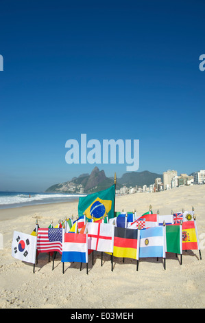 International football country flags with soccer ball on Ipanema beach in Rio de Janeiro Brazil Stock Photo