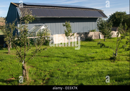 Solar PV photovoltaic panels on roof of barn Mickleton UK Stock Photo