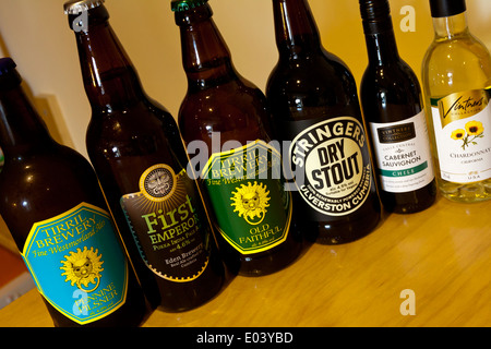 Bottles of traditional beer from the Lake District Cumbria England UK with miniature wine bottles on a bar Stock Photo