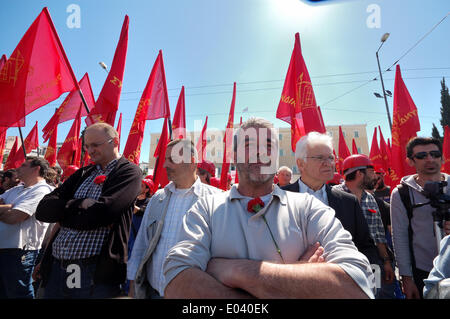 Athens, Greece. 1st May 2014. ATHENS.GREECE MAY 1ST- Demonstrators that support KKE (Greek Communist Party) holding red flags stand in front of the Greek parliament (Photo by George Panagakis / Pacific Press/Alamy Live News) Stock Photo