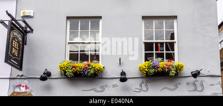The Eel Pie pub exterior - sign, colourful flowers in window boxes and cartoon,   Church Street, Twickenham, Greater London, UK Stock Photo