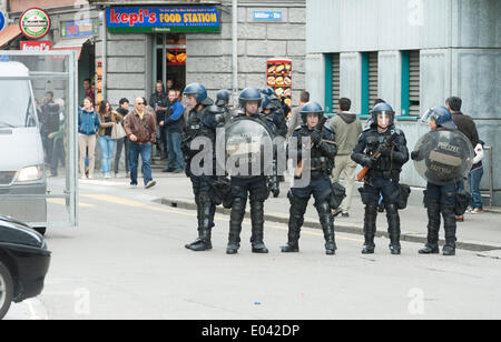 Zurich, Switzerland. 1st May, 2014. Armed police forces are getting ready at an illegal May Day protest rally at Zurich's Helvetiaplatz. The rally disbanded after police squads sealed the place for one hour. Credit:  Erik Tham/Alamy Live News Stock Photo