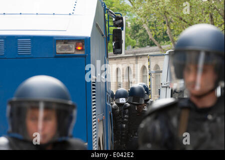 Zurich, Switzerland. 1st May, 2014. Armed police forces get ready behind a water cannon to end an illegal May Day protest rally at Zurich's Helvetiaplatz. The rally disbanded after police squads sealed the place for one hour. Credit:  Erik Tham/Alamy Live News