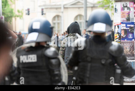 Zurich, Switzerland. 1st May, 2014. Armed police forces prepare to assault an illegal May Day protest rally at Zurich's Helvetiaplatz. The rally disbanded after police squads sealed the place for one hour. Credit:  Erik Tham/Alamy Live News Stock Photo