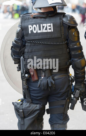 Zurich, Switzerland. 1st May, 2014. Armed police forces are deployed at an illegal May Day protest rally at Zurich's Helvetiaplatz. The rally disbanded after police squads sealed the place for one hour. Credit:  Erik Tham/Alamy Live News Stock Photo