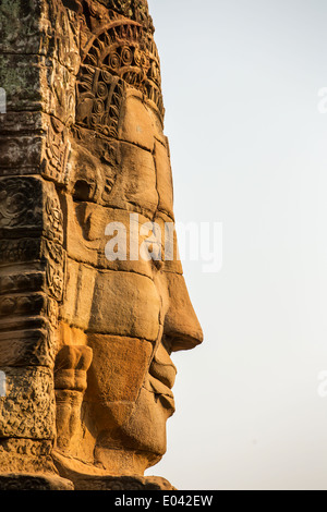 Stone face on the tower of ancient Bayon Temple in Angkor Thom, Cambodia Stock Photo
