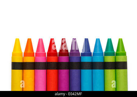 Craoyons lined up in rainbow isolated on white background. Stock Photo