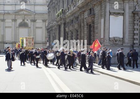 Milan, Italy. 1st May 2014.  Parade of confederated unions CGIL, CISL and UIL. Banner of Milan and town band 'Orchestra dei FIATI' at the head of procession. Credit:  Claudio Rancati / Alamy Live News Stock Photo