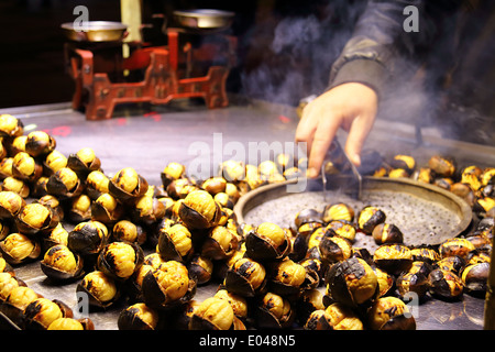 Roasted Chestnut Vendor Closeup On The Street Stock Photo