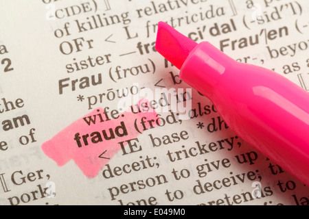 The Word Fraud Highlighted in Dictionary with Yellow Marker Highlighter Pen. Stock Photo
