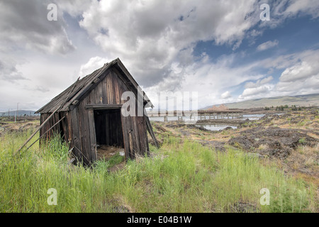 Old Abandoned Native American Fishing Shacks Along Columbia River by the Dalles Bridge in Oregon Stock Photo