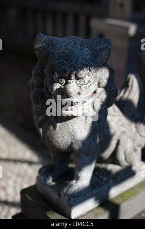 Komainu statue at a temple In Tokyo, Japan Stock Photo