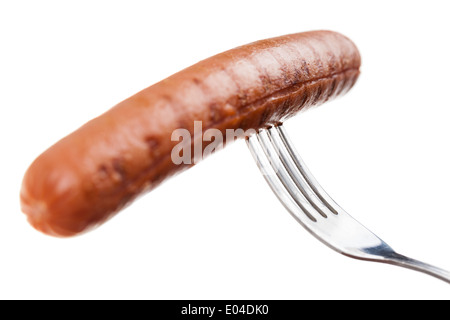 a delicious sausage on a fork over white Stock Photo
