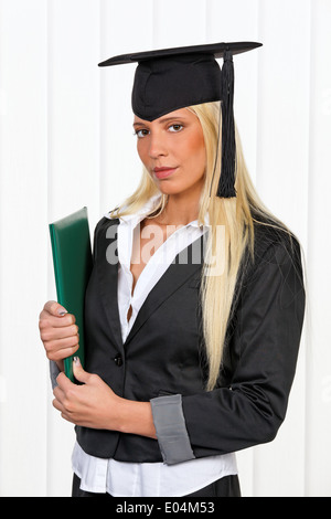 Young woman ace a ready graduate anuses the study, Junge Frau als fertige Absolventin nach dem Studium Stock Photo