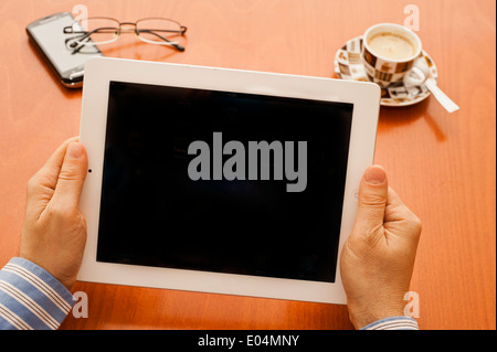 man hands holding tablet computer, blank screen Stock Photo