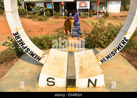 equator sign on the road at uganda, africa Stock Photo