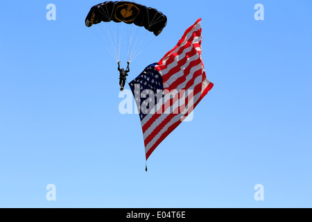 The American flag being flown by a skydiver while dropping from the sky Stock Photo