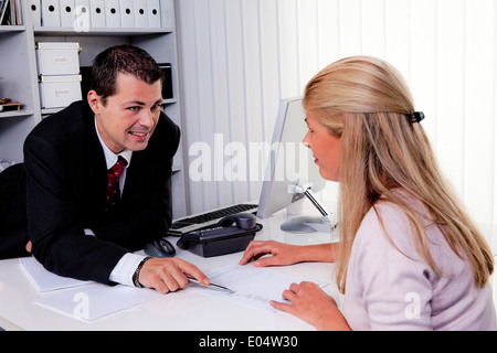 One and woman with a consultation, Mann und Frau bei einem Beratungsgespraech Stock Photo