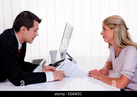 One and woman with a consultation, Mann und Frau bei einem Beratungsgespraech Stock Photo