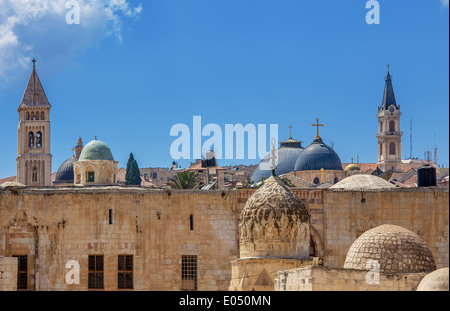 Belfries and domes of christian churches and minarets of mosques under blue sky in Jerusalem, Israel. Stock Photo