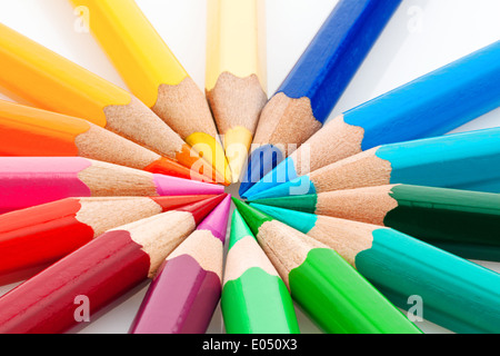 Many different coloured colour pencils on a white background., Viele verschiedene bunte Farbstifte auf einem weissem Hintergrund Stock Photo