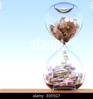 business growth and wealth over time (money in the sand clock  conceptual financial picture) Stock Photo