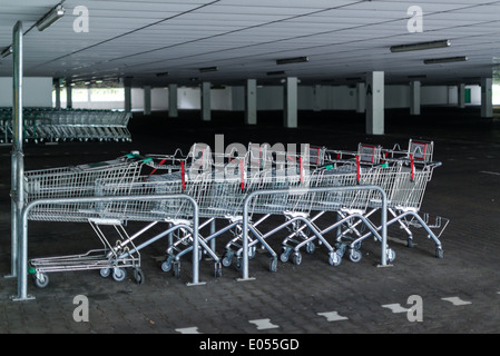 Rows of shopping carts in abandoned car park Stock Photo