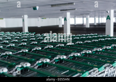 Rows of shopping carts in abandoned car park Stock Photo