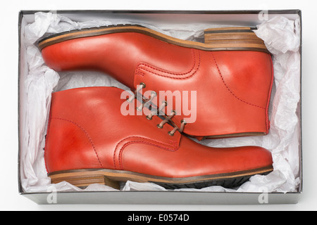 new red shoes in box with wrapping paper Stock Photo