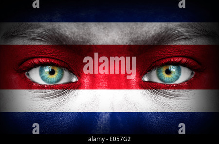 Human face painted with flag of Costa Rica Stock Photo