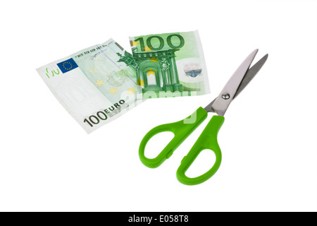 From a euro of bank note a piece is cut off with scissors. , Von einem Euro Geldschein wird mit einer Schere ein Stueck abgeschn Stock Photo