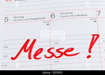 An appointment is put down in a calendar: Fair, Ein Termin ist in einem Kalender eingetragen: Messe