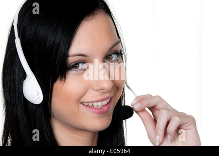Woman with Headset in the customer service. Phone hotline, Frau mit Headset im Kunden Service. Telefon Hotline Stock Photo