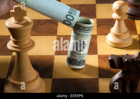 Chess with dollar and euro of bank note. Symbol for devaluation of the dollar against euro., Schach mit Dollar und Euro Geldsche Stock Photo