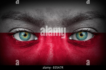 Human face painted with flag of Poland Stock Photo