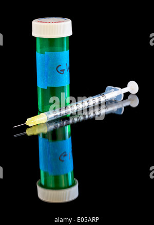 hypodermic needle and jar of medicine ready to inject Stock Photo