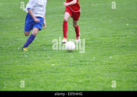 Soccer or football players in action on the field Stock Photo