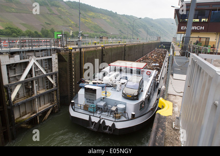 Dutch boat with renewable scrap metal in the lock at Enkirch along the Mosel in Germany Stock Photo