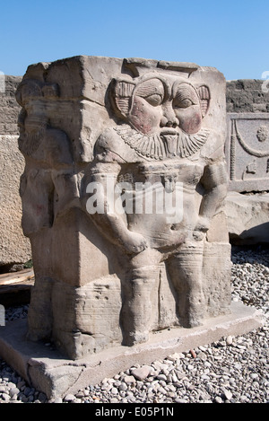 Egypt,Dendera,Ptolemaic temple of a goddess Hathor.A colossal statue of the god Bes in the coutyard Stock Photo