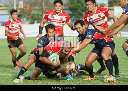 Michael Leitch of Japan is tackled by Jake Letts of the Philippines during their Rugby World Cup qualifying match in Silangan, Laguna on May 3, 2014. Japan won against the Philippines, 99-10.(Photo by Mark Fredesjed R. Cristino / Pacific Press) Stock Photo