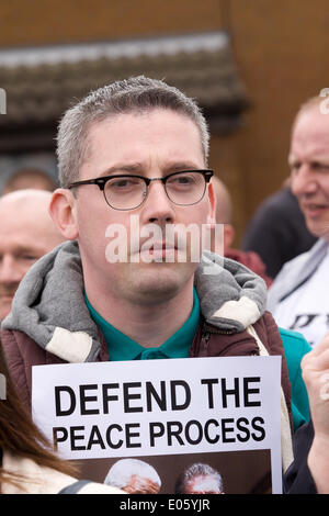 Divis Street, Belfast, Northern Ireland, UK. 3rd May 2014. Niall Ó Donnghaile at the new mural on Divis Street, Belfast, against the continuing detention of Mr Adams Credit:  Bonzo/Alamy Live News Stock Photo