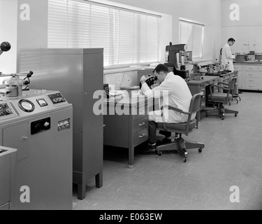 Technician Allen Larkins and engineer David Willinger work in the metallurgical laboratory at NASA’s Plum Brook Research Reactor Facility, conducting materials research and testing. Stock Photo