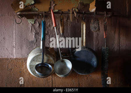 Vintage kitchen instruments hanging on wall Stock Photo