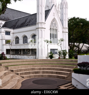 View from amphitheatre steps of exterior external white painted stucco of St Andrew's Cathedral, an Anglican church in North Bridge Road, Singapore Stock Photo