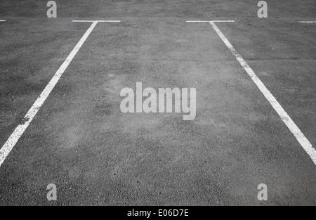 Empty parking place with white marking lines on asphalt Stock Photo