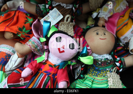 A selection of colorful handmade rag dolls for sale at Cancun Airport, Mexico Stock Photo